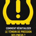 Un tableau de bord de voiture montrant le témoin de pression des pneus allumé
