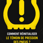 Un tableau de bord de voiture montrant le témoin de pression des pneus allumé